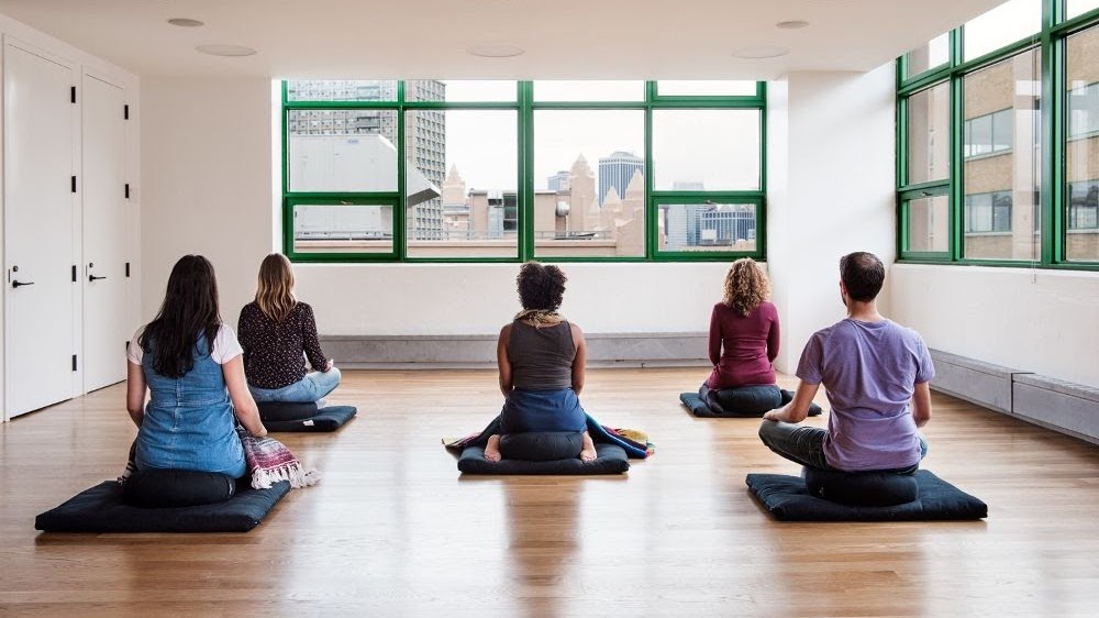 A team yoga class in the Etsy New York office
